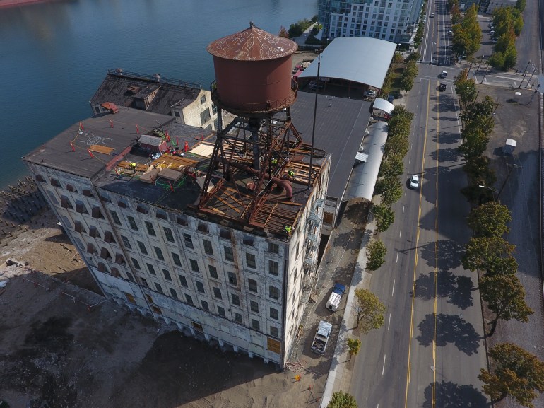 Rusted water tank on vintage building. Portland, OR.